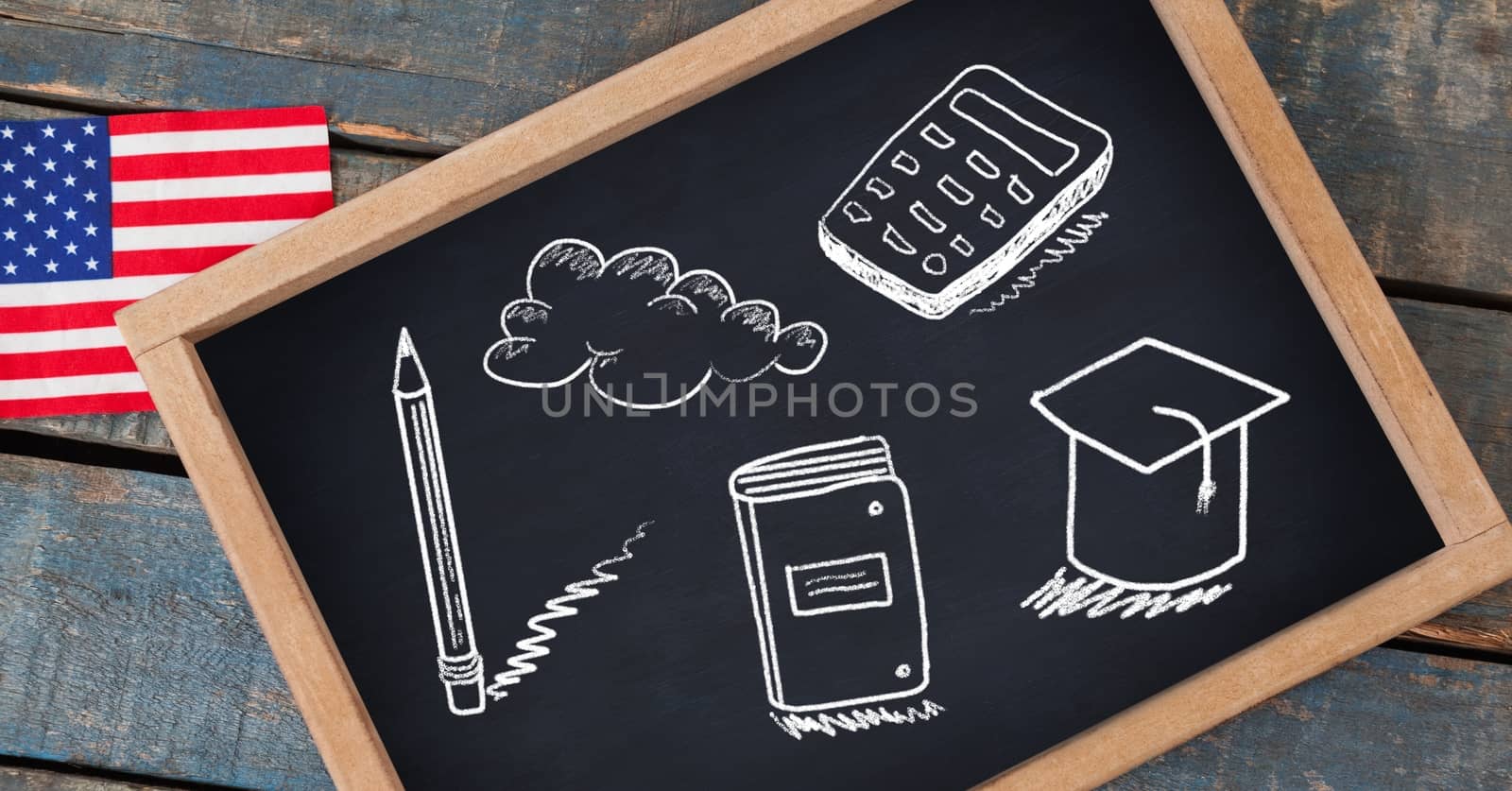 education drawings on blackboard for school with American flag by Wavebreakmedia