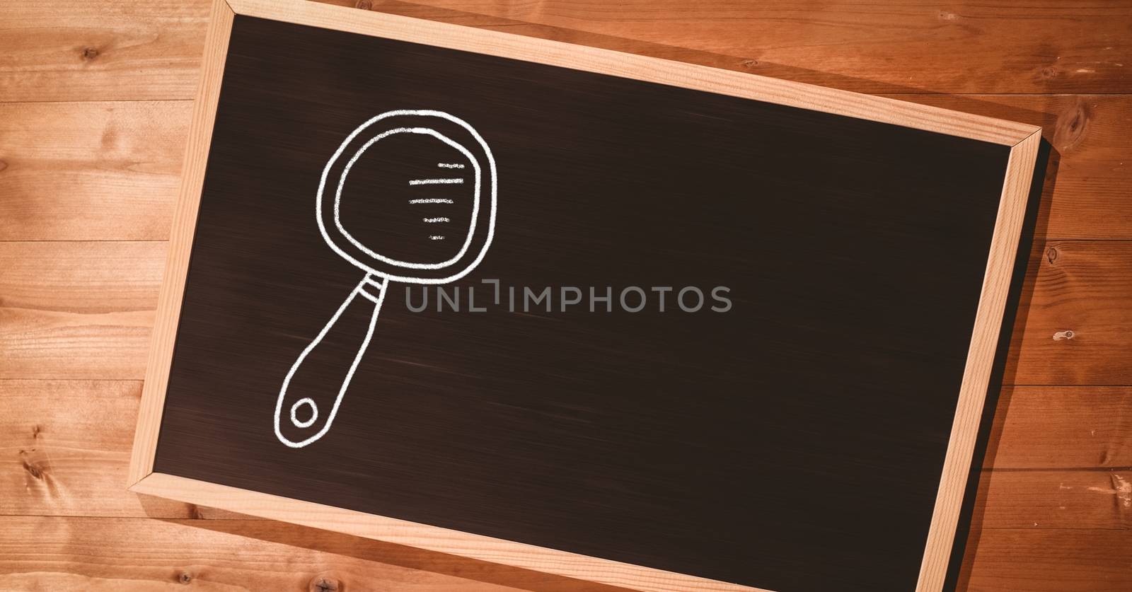 Digital composite of Magnifying glass Education drawing on blackboard