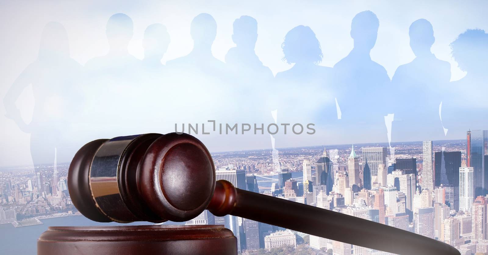 Gavel and people silhouettes over city by Wavebreakmedia