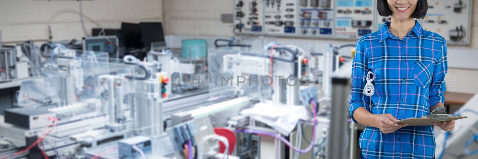 Female architect holding clipboard and blueprint against grey background against image of technology