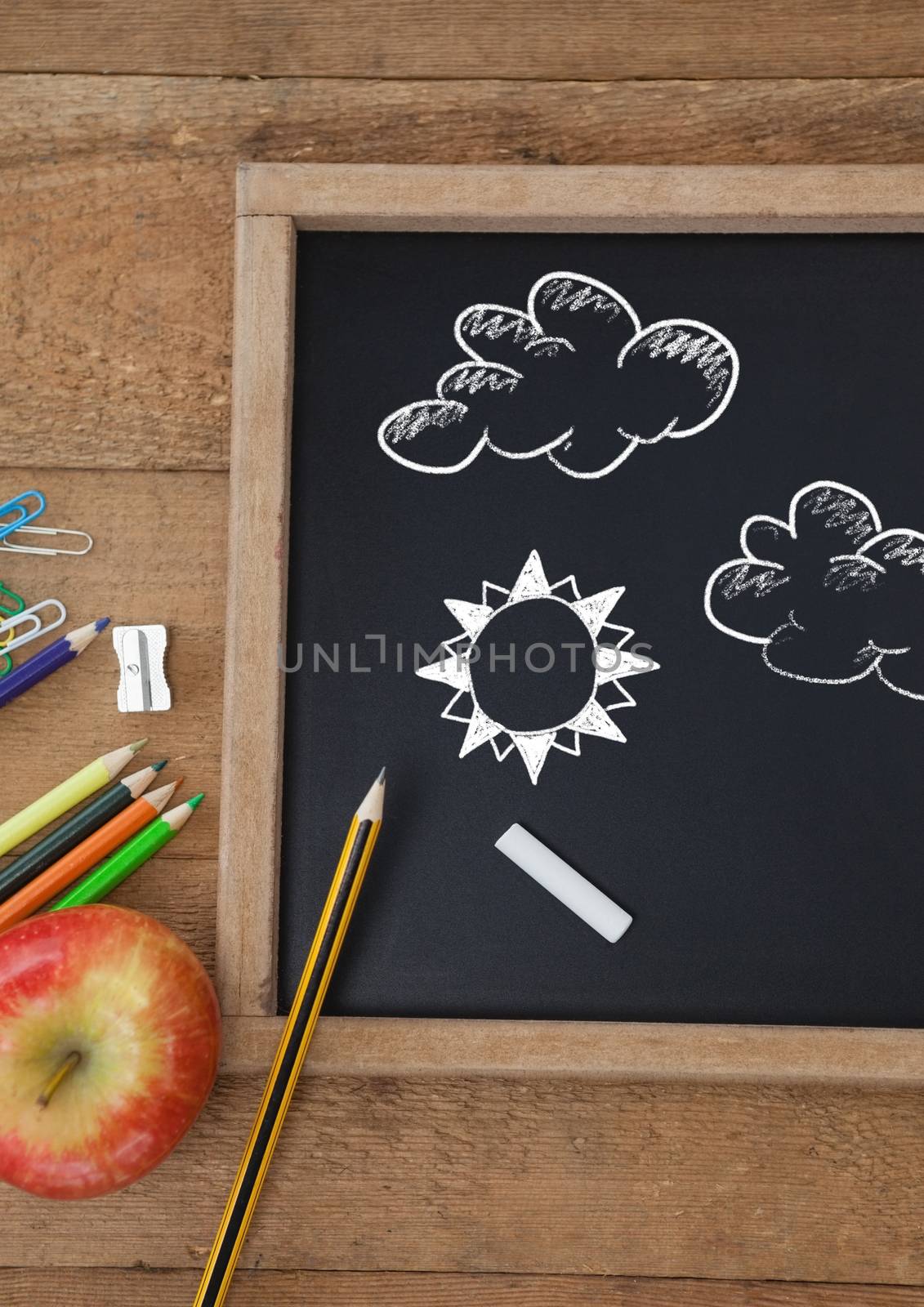 Clouds and sun Education drawing on blackboard for school by Wavebreakmedia