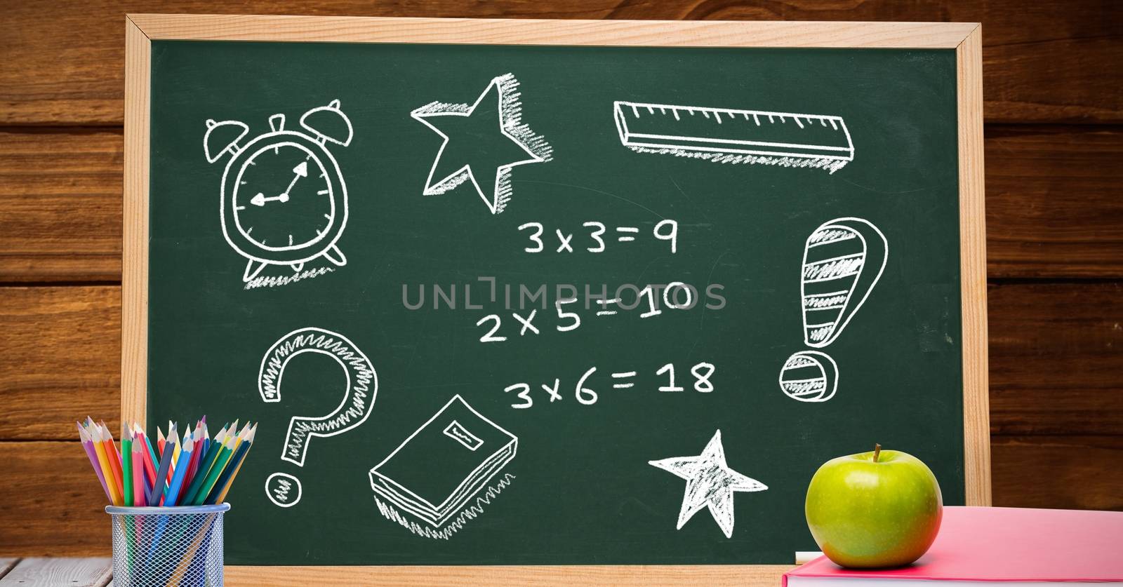 Math education drawings on blackboard for school by Wavebreakmedia