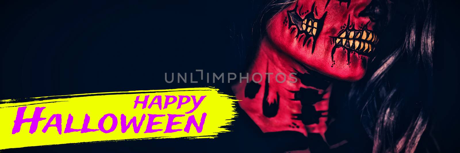 Digital image of happy Halloween text against attractive young woman with halloween makeup
