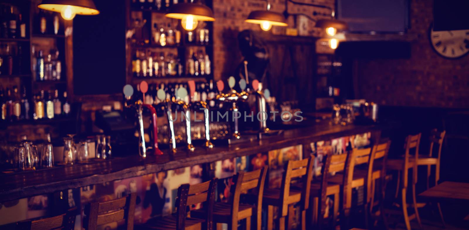 Empty chairs arranged in pub