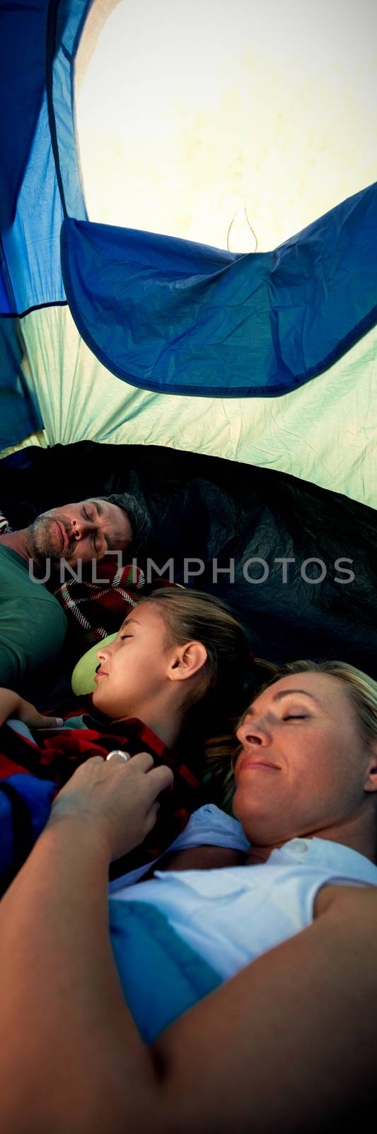 Family sleeping peacefully in the tent