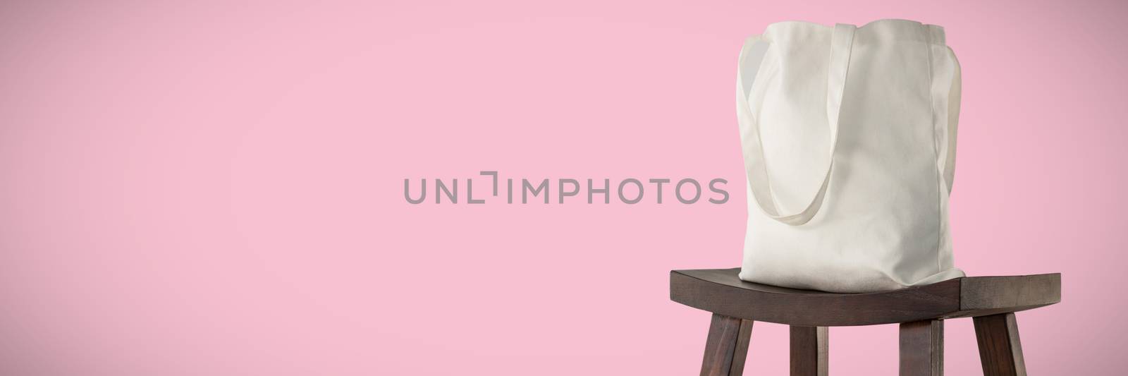 Canvas bag against pink background