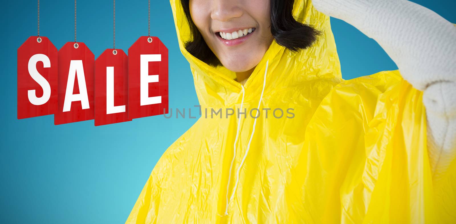 Woman wearing yellow raincoat against white background against abstract blue background