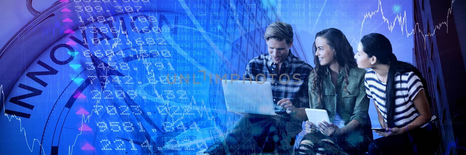 Business people discussing over laptop while sitting on seat against stocks and shares