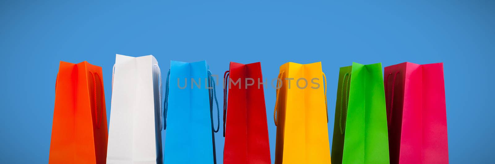 Shopping bags against blue background