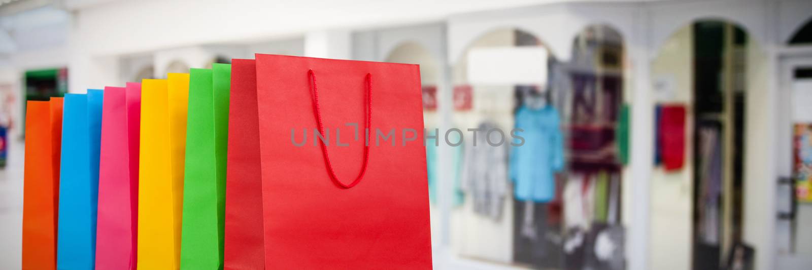 Shopping bags against interior of modern shopping mall
