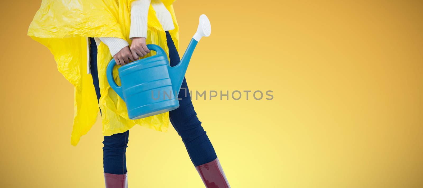 Composite image of woman in yellow raincoat holding an watering can by Wavebreakmedia