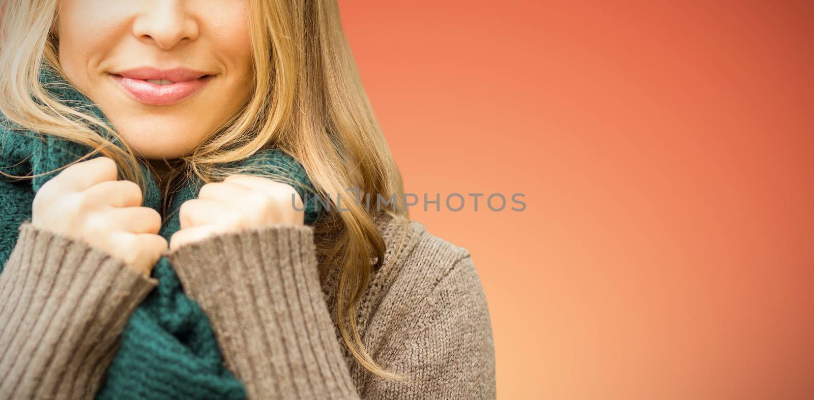 Composite image of smiling pretty woman holding her scarf by Wavebreakmedia
