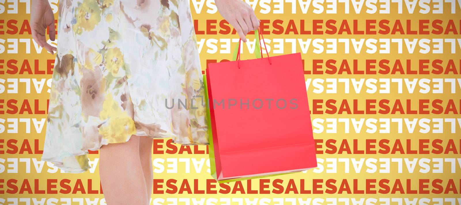 Elegant woman with shopping bags against abstract yellow background