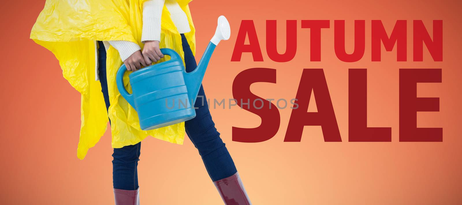 Composite image of woman in yellow raincoat holding an watering can by Wavebreakmedia