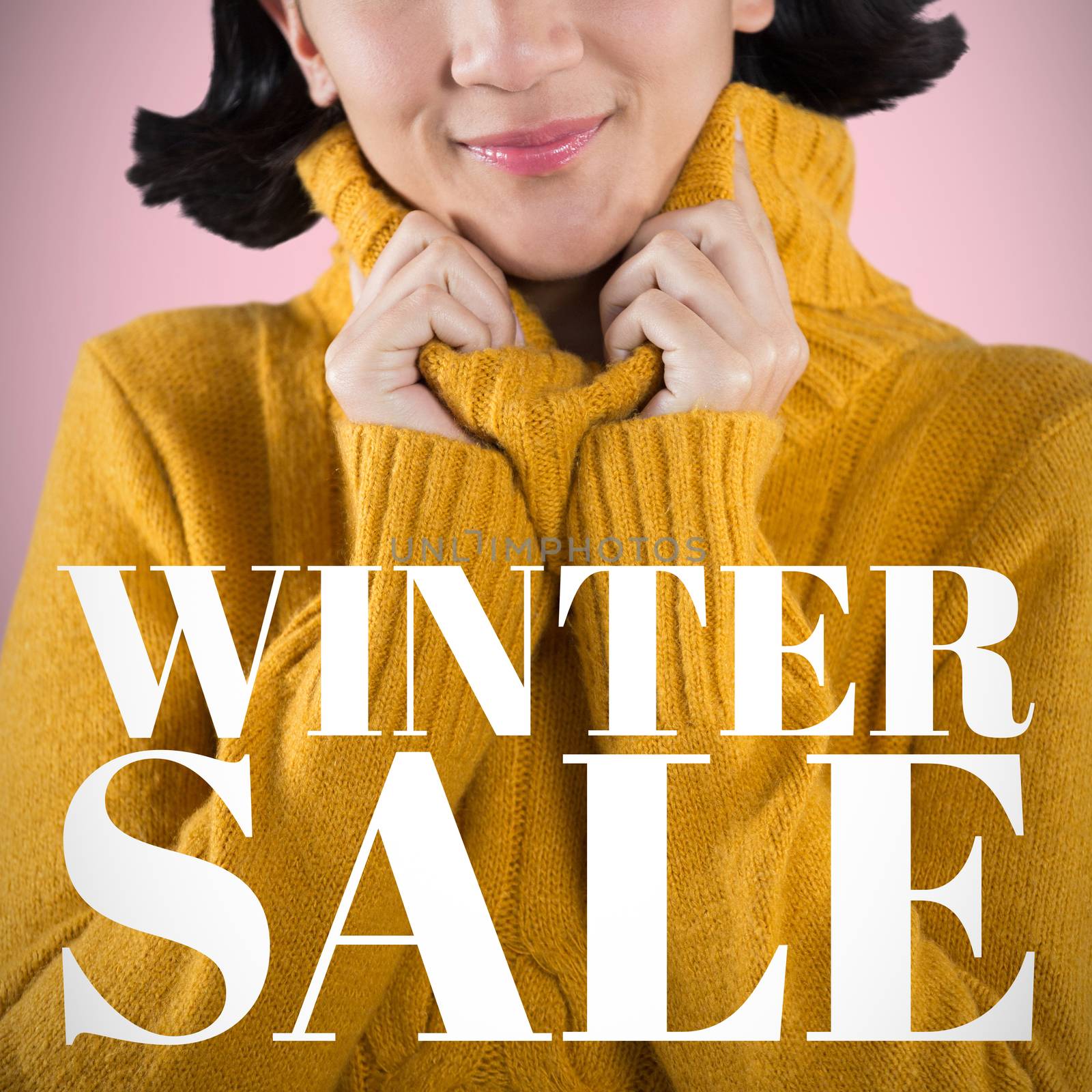 Woman in winter clothing posing against white background against pink background 