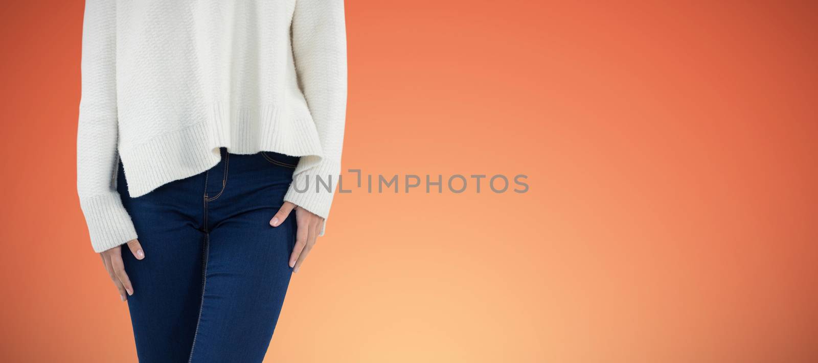 Woman in wellington boot standing with leg crossed against abstract yellow background