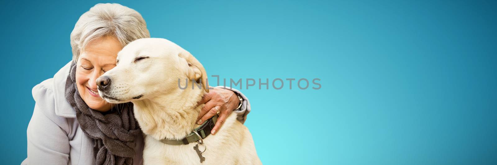Composite image of senior woman holding a dog by Wavebreakmedia