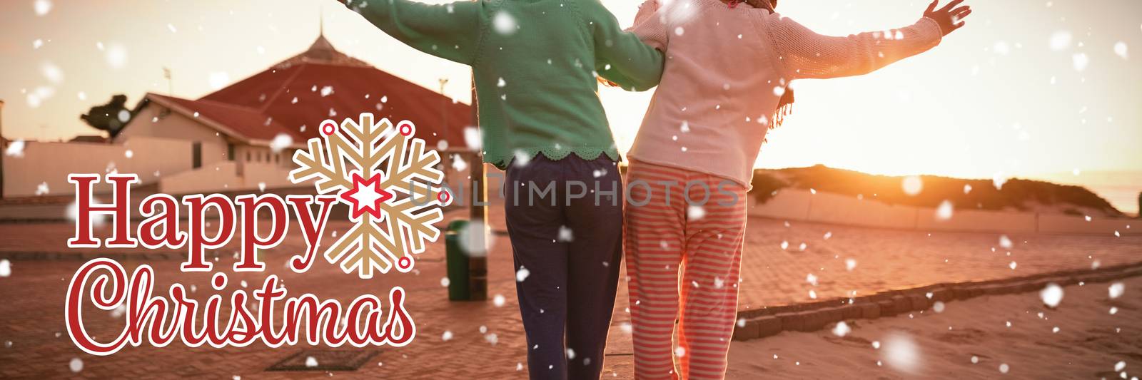 Christmas card against two women walking holding each other