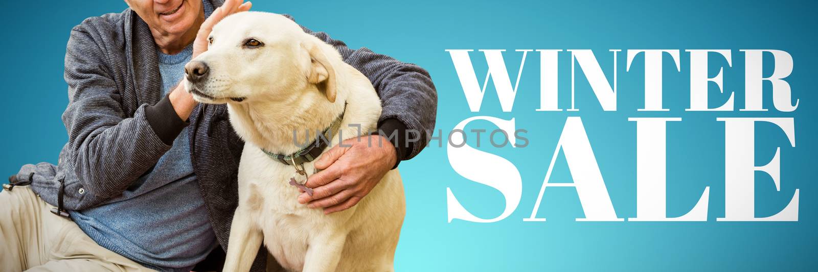 Smiling old man sitting stroking his pet dog against abstract blue background