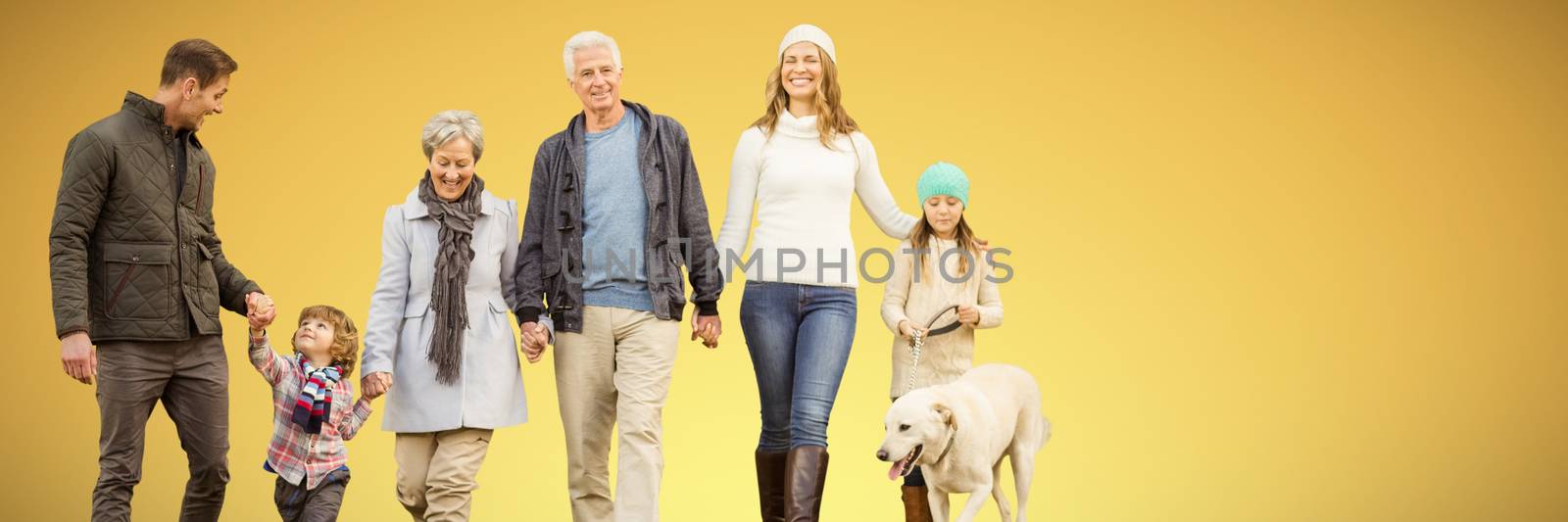 Composite image of happy family walking with their dog by Wavebreakmedia