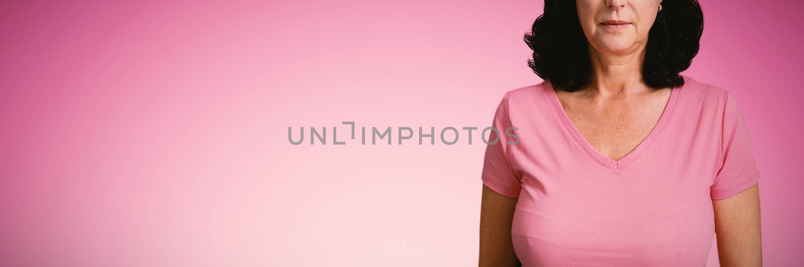 Composite image of women in pink standing by Wavebreakmedia
