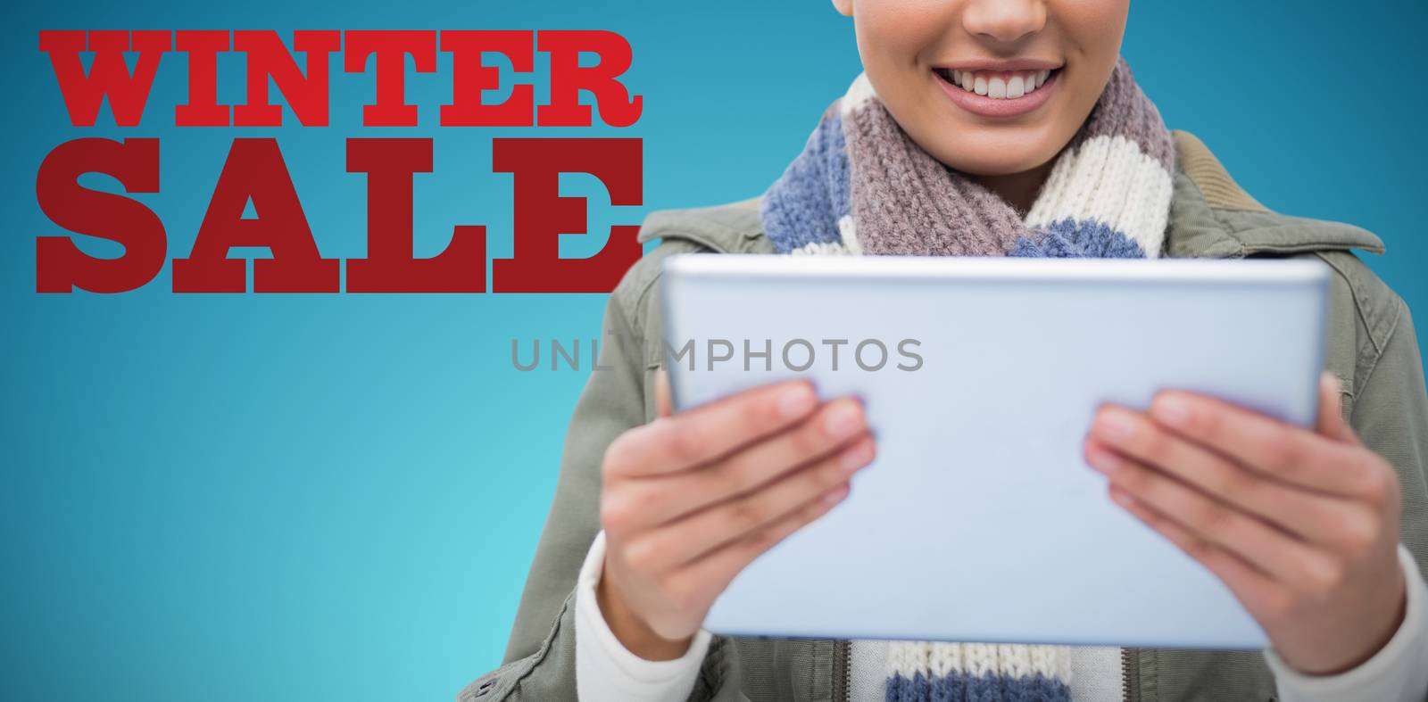 Composite image of  women holding tablet against abstract blue background