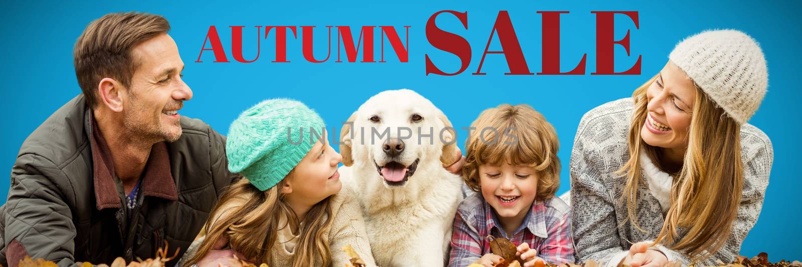 Young family with a dog against blue background