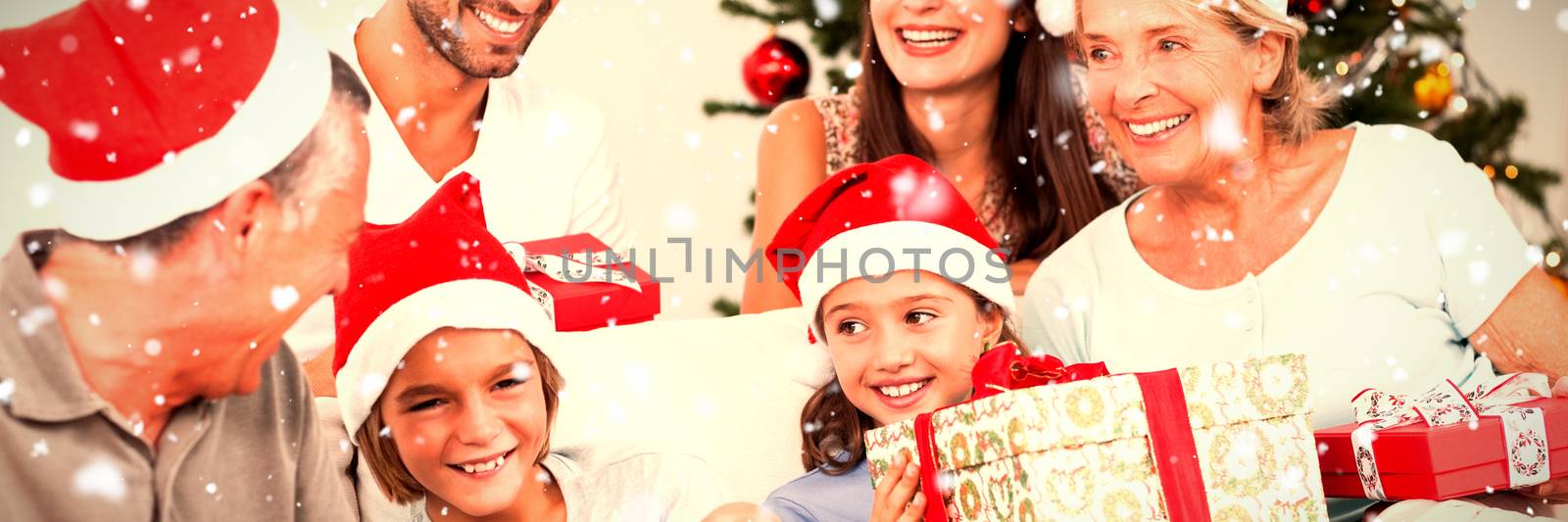 Composite image of happy family at christmas swapping gifts by Wavebreakmedia