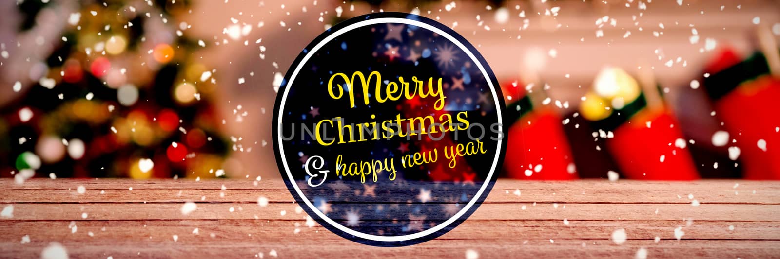  "Merry christmas and happy new year" against bottle of whiskey and two glasses on wooden table