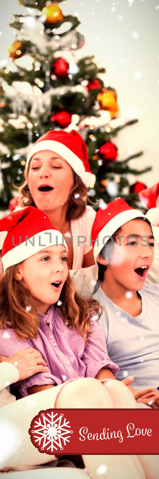 Composite image of extended family singing carols by Wavebreakmedia