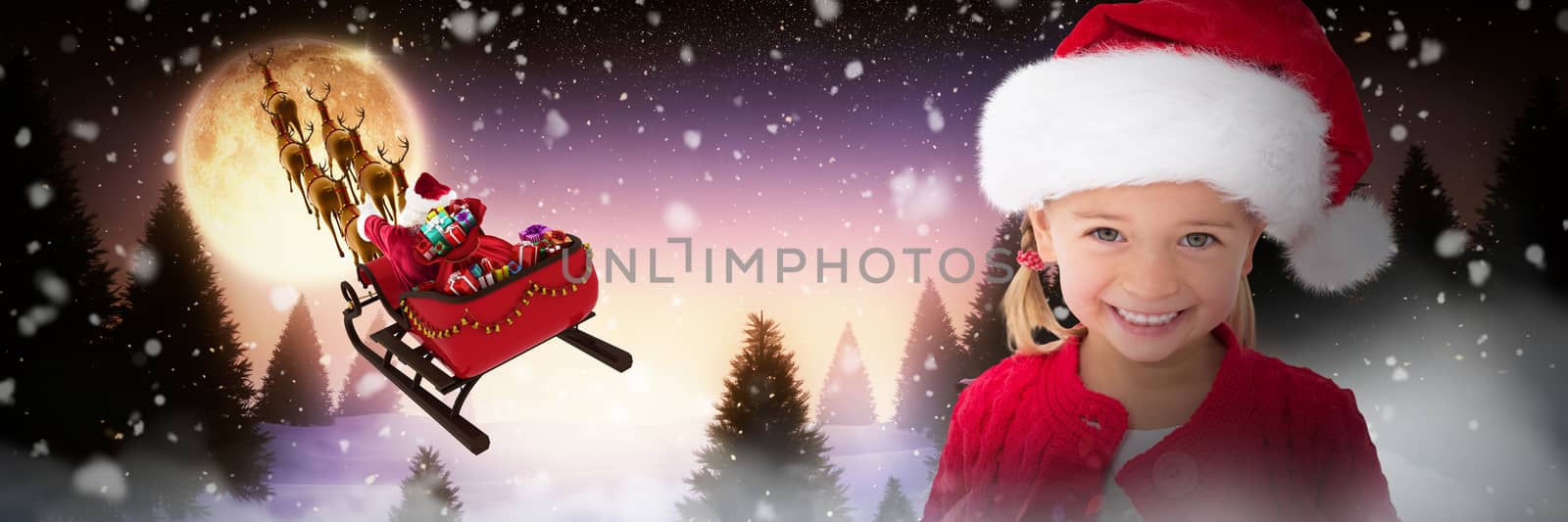Composite image of cute little girl wearing santa hat by Wavebreakmedia