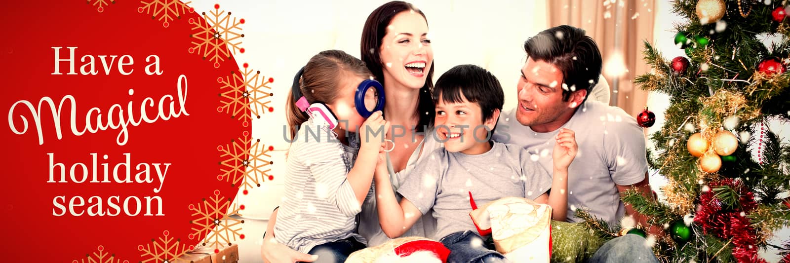 Happy family playing with Christmas gifts against white and red greetings card