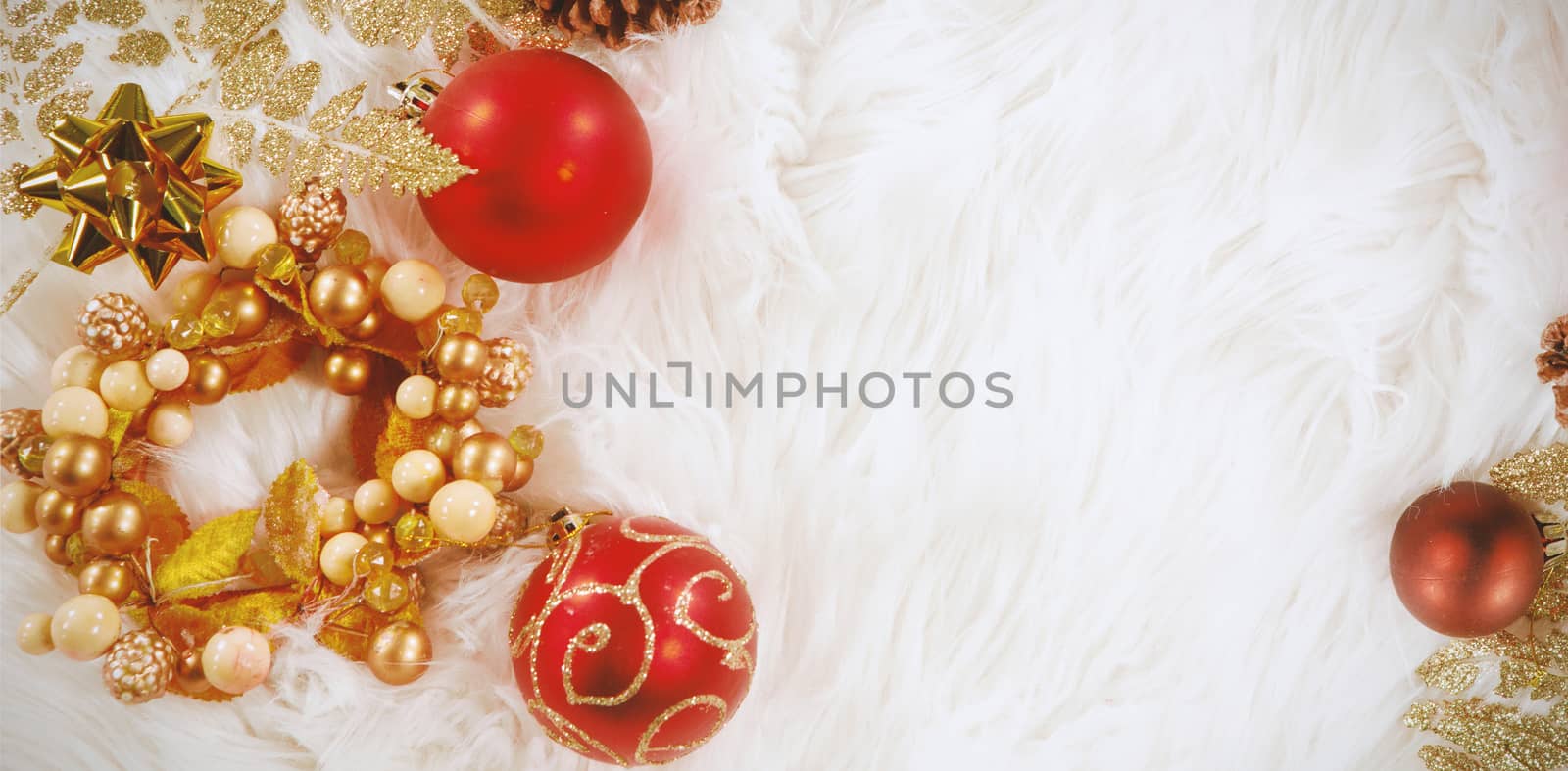 Christmas decoration lying on white fur carpet