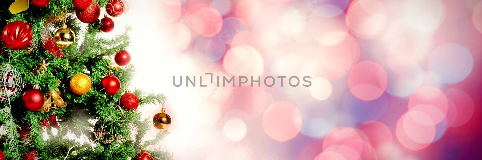 Glowing christmas background against christmas pine tree with gifts