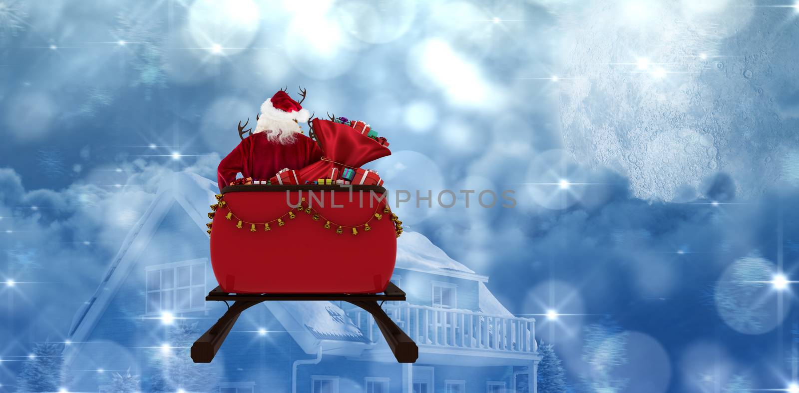 Rear view of Santa Claus riding on sled with gift box against moon lighting house 