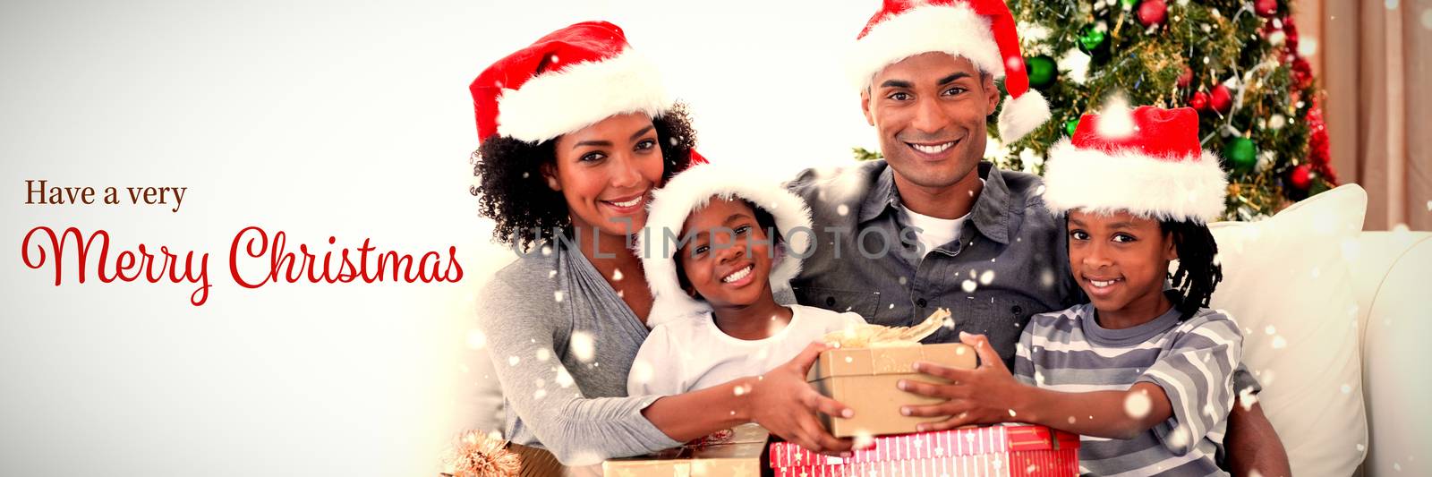 Smiling family sharing Christmas presents against christmas card
