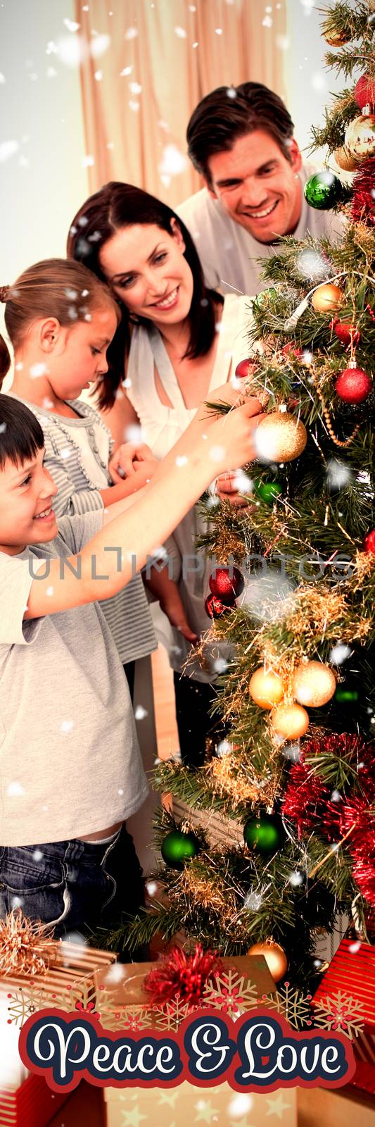 Happy family decorating a Christmas tree with boubles against peaceful message