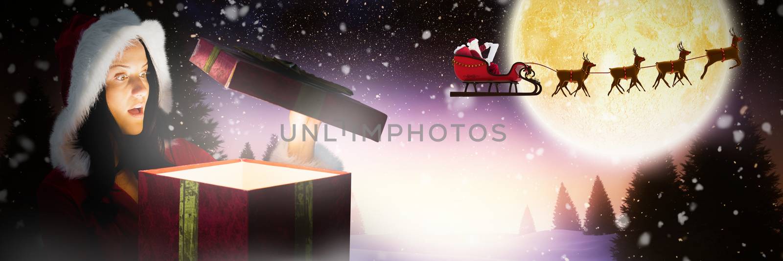 Composite image of surprised woman opening christmas present by Wavebreakmedia