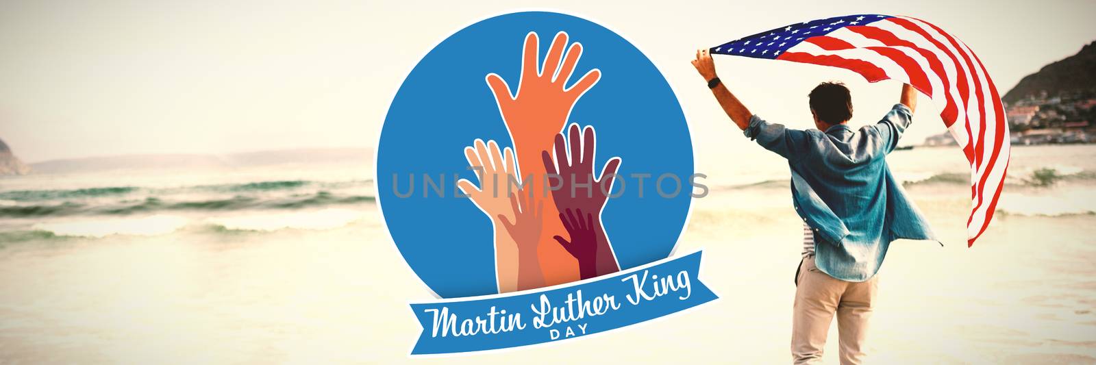 Martin Luther king day with hands against man carrying american flag on shore