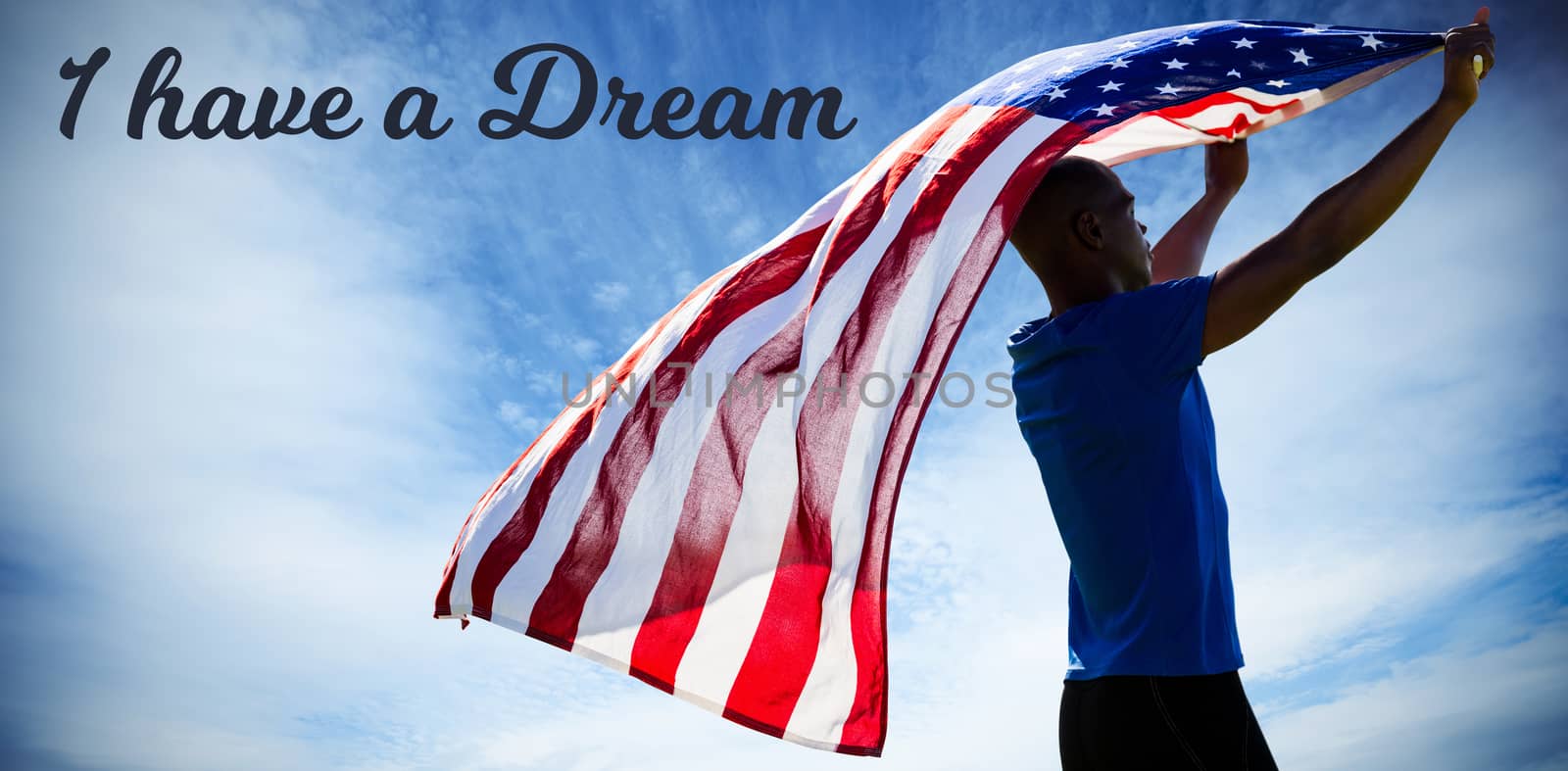 Rear view of sportsman raising an american flag  against view of cloudy sky