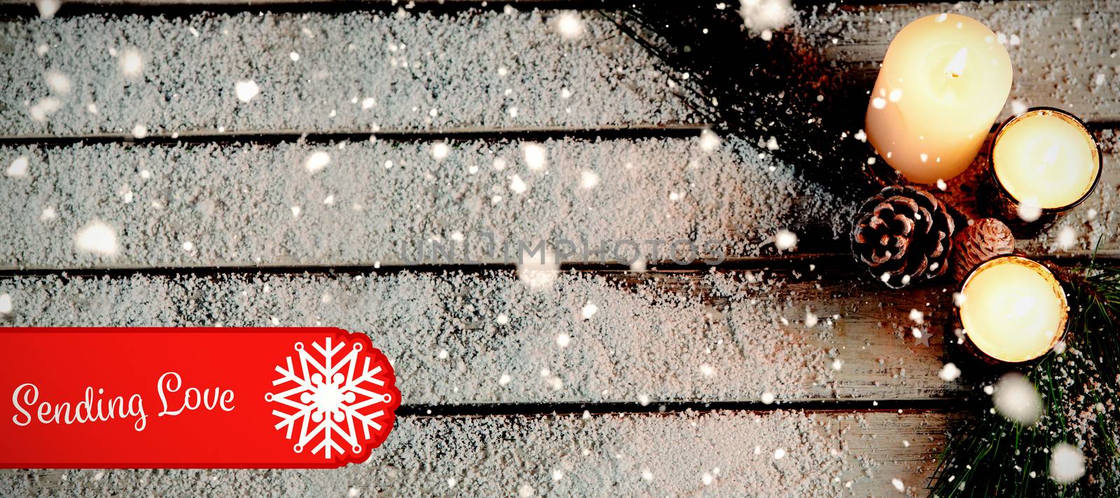 Banner sending love against copy space in the snow with candles