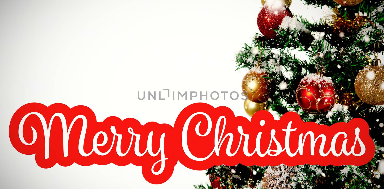 White and red greeting card against christmas decorations hanging in tree