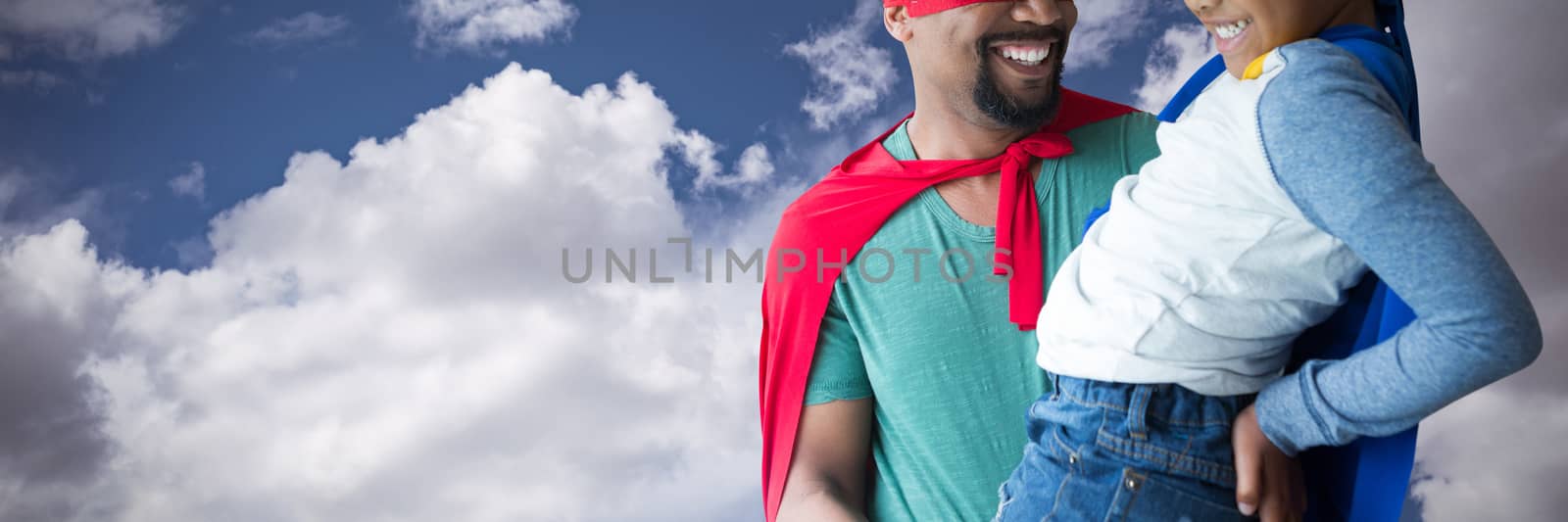 Composite image of father and son pretending to be superhero by Wavebreakmedia
