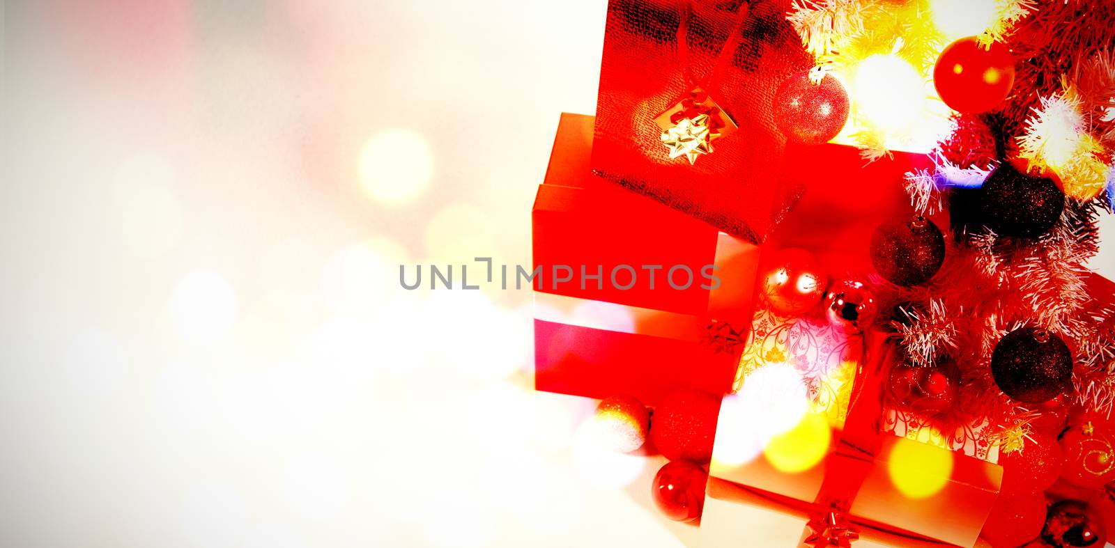 Composite image of table against christmas gifts with copy space