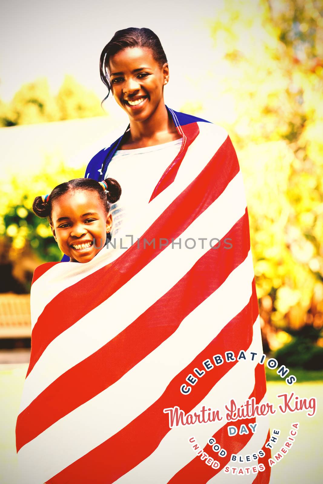 Martin Luther king day against portrait of mother and daughter wrapped in american flag at park