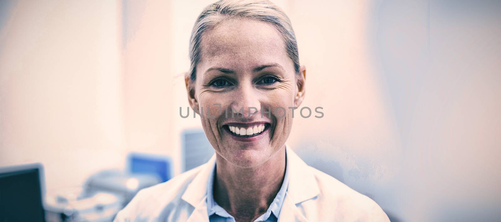 Portrait of female dentist smiling by Wavebreakmedia