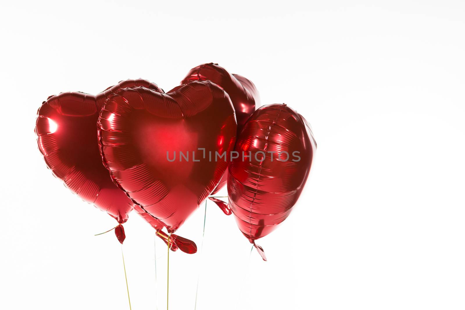 Close-up of Valentine balloons against white background
