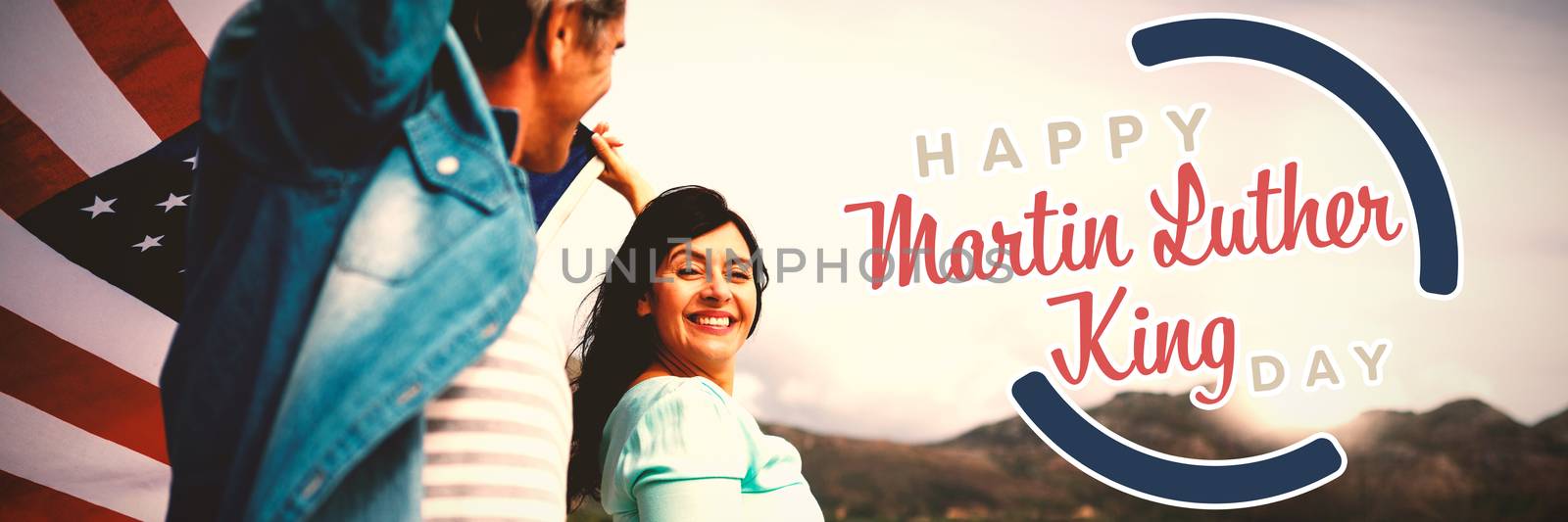 happy Martin Luther King day against happy couple holding american flag on shore