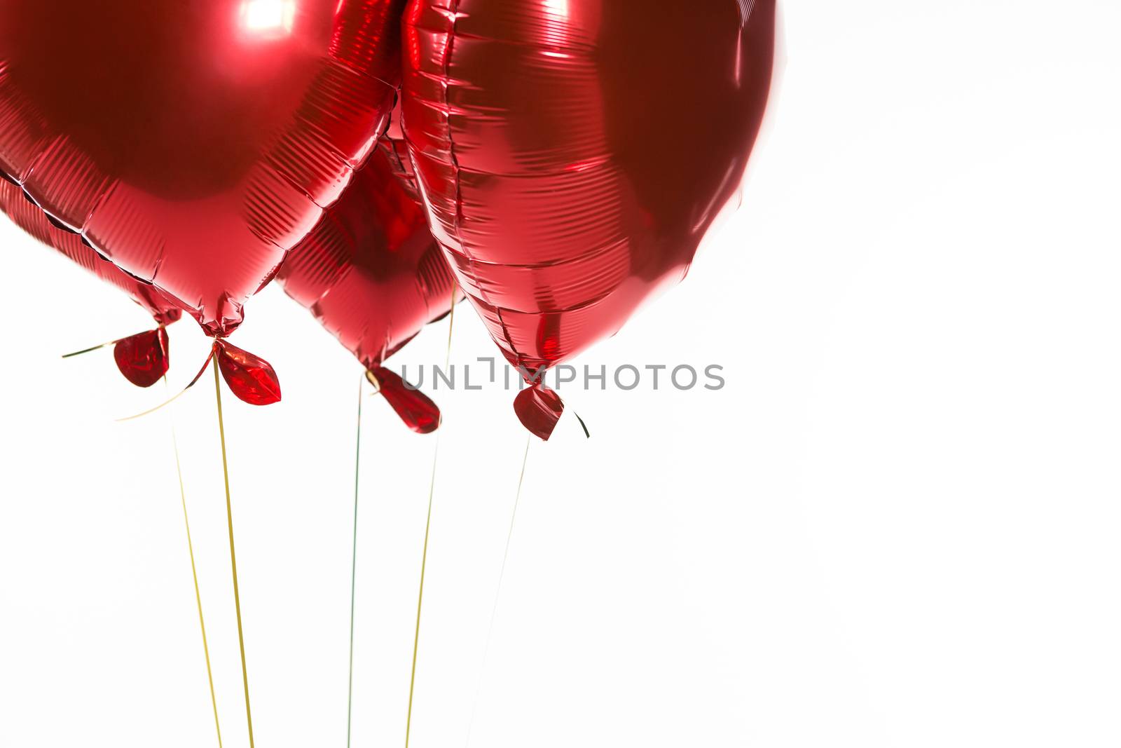 Close-up of Valentine balloons against white background