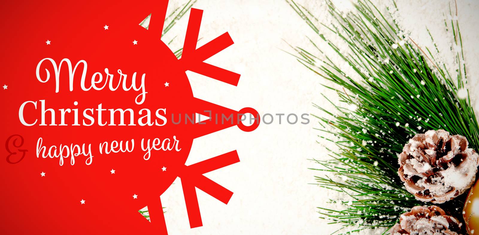 White and red greetings card against christmas decoration covered in snow